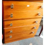 A teak five drawer chest.