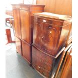 A reproduction mahogany cocktail cabinet, with cupboard top, above false drawer base, and a further