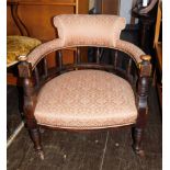 An Edwardian walnut tub chair.