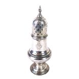 A George V silver sifter, with urn finial, pierced domed lid, inverted bellied body, inverted stem a