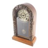 An early 20thC Takano domed mantel clock, the case raised with Oriental figures, revealing a 13cm di