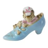 A Beatrix Potter figure The Old Woman Who Lived in a Shoe, gold oval mark beneath, 7cm high.