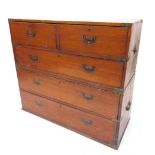 A 19thC teak and brass bound military chest, with two short and three long drawers, ebonised metal s