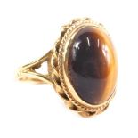 A 9ct gold tiger's eye dress ring, set with oval stone, size J, 4.1g all in.