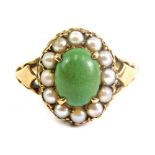 A 9ct gold dress ring, claw set with central green stone surrounded by pearls, size N, 1.8g.