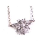 A 20thC bee pendant charm, attached to a link necklace marked 375, 38cm long.