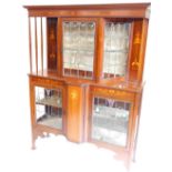 An Edwardian mahogany and marquetry display cabinet in the manner of Shapland & Petter, with a mould