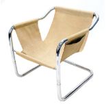 A 1970's chrome painted tubular armchair, (AF), 63cm wide.