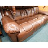 A three seater brown leather DFS Supreme electric reclining settee, with iPhone charger ports, 117cm