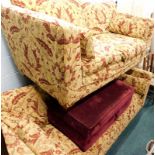 A matching two piece suite, comprising three seater and two seater settees, in yellow and floral pat