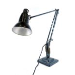 A vintage Anglepoise lamp, with black shade 20cm wide, and articulated stem on square base.