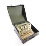 A mid 20thC Art Deco design Geraldo piano accordion, in mother of pearl finish case, 32cm wide. (cas