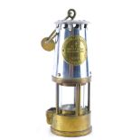 An Eccles Six miner's lamp, in brass and chrome plated case, with S scroll handle, 27cm high.