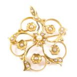A floral pendant brooch, set with seed pearls, plain bin back, marked 14K and Birks, 2cm high, 4g al