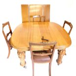 A Victorian oak extending dining table, the top with a moulded edge and rounded corners, on bulbous