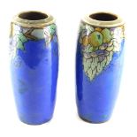 A pair of Royal Doulton Lambeth vases, numbered 8530, sgraffitto decorated with fruit on blue ground