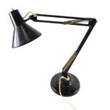 A vintage Anglepoise lamp, with black metal cone shaped shade 15cm long, articulated stem and circul