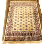 A gold Cashmere type full pile design rug, in yellow, 168cm x 117cm.