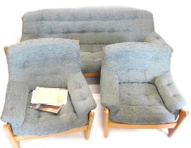 An Ercol Wychwood elm three piece suite, re-upholstered in grey fabric, the sofa 189cm wide. Purch