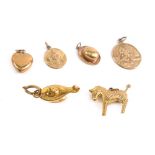 Various 9ct gold and other charms, oil lamp, 1cm high, etc., some pieces unmarked, 8.3g all in. (a q