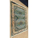 A machine woven Eastern pattern rug, in blue and cream with multiple borders, 200cm x 280cm.