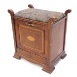 An Edwardian walnut and inlaid piano stool, with a padded seat, the fall front enclosing divisions f