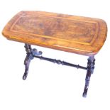 A Victorian walnut occasional table, the rectangular crossbanded top with shaped ends, on turned sup
