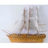 A scratch built model of an 18th or 19thC three masted war ship, 90cm long.