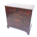 A George III mahogany chest of drawers, the top with a moulded edge above two short and three long d