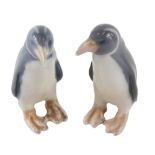 A pair of Royal Copenhagen pottery penguins, 1283, printed marks beneath, 11cm high. (2)