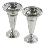A pair of George V silver stem vases, by Hukin & Heath, with trumpet bodies, Birmingham 1922, loaded