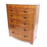 A Victorian mahogany bow fronted chest of drawers, the top with a rounded edge above two short and f