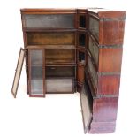 An early 20thC Globe Wernicke oak bookcase, in three parts, comprising two four section bookcases an