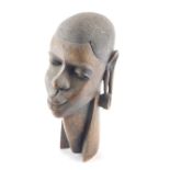A 20thC African hardwood tribal head, with shaped neck, 33cm high.