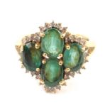 Withdrawn Pre-Sale by Vendor An 18ct gold dress ring, claw set with four central green