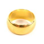 A 22ct gold wedding band, size K, 8.1g.
