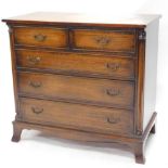 A mahogany chest of drawers, in George III style, the top with a crossbanded border, above two short
