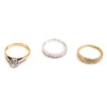 Various dress rings, a half eternity marked 925 set with small white stones, a crossover ring and a
