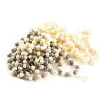 A group of pearls, comprising a two colour natural pearl necklace, with knotted strand and grey and