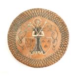 A 17thC style slipware charger, with a lattice work border, figure and two shield decoration and pud