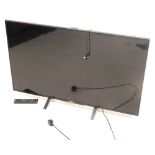A Sony 48" LCD television with remote and cable.