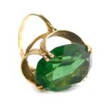 A 9ct gold dress ring, claw set with green stone, size K, 6.1g all in.