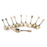 A harlequin set of ten George III and later silver table spoons, fiddle pattern, initialled, London