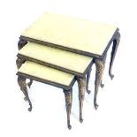 A nest of three onyx and brass tables, each on cabriole legs, the largest 52cm wide.