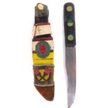 A mid 20thC Boy Scout's dagger, in sheath with Boy Scouts fox head badge, with plain blade and turne