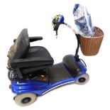 An Eden Mobility four wheeled mobility scooter, with front basket, power charger and canvas bag, 98c