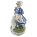 A Royal Copenhagen figure of a girl aside goose, number 527 UF, printed marks beneath, 27cm high.