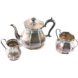 A three piece silver plated tea service, comprising teapot, two handled sugar bowl and milk jug, 9cm