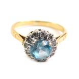 A blue zircon and diamond dress ring, illusion set with claw set central stone, marked 18ct, size M,