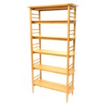 An Ercol oak 3671 Teramo open shelving unit, with turned supports, 186cm high, 94cm wide.